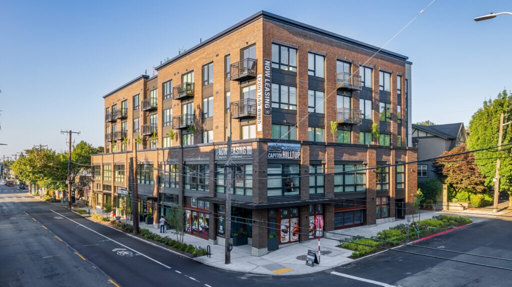 Exterior Image from the corner of Capitol Hilltop Apartments on a sunny day